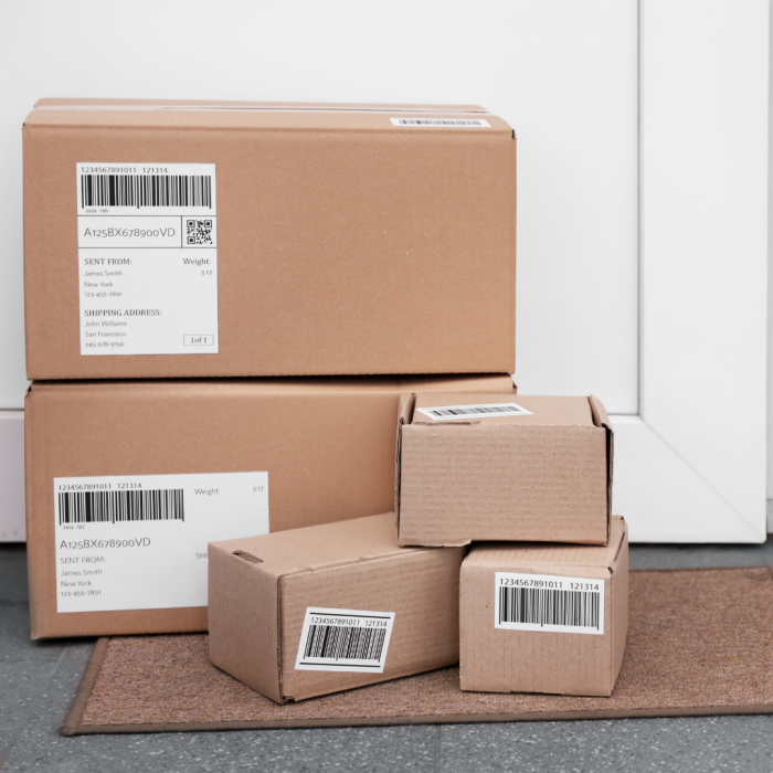 corrugated boxes of various sized waiting on a someones doorstep