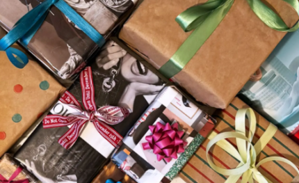 a group of holiday presents wrapped in sustainable wrapping paper