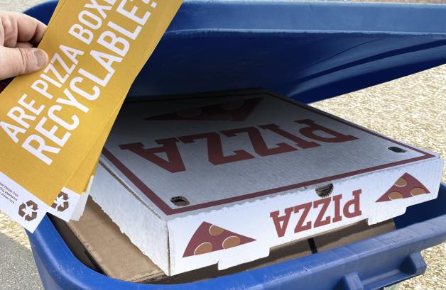 Pizza boxes in a recycling bin